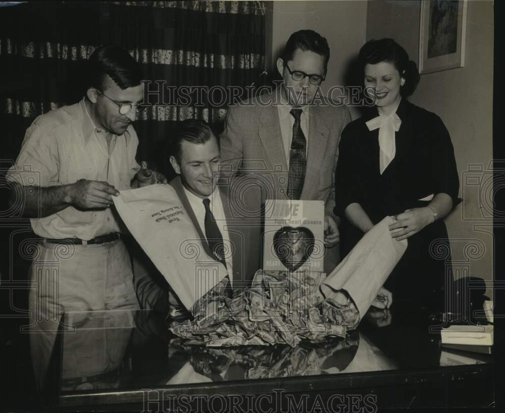 1954 Press Photo Walter Corrigan &amp; Others Dumping Money Bags on Desk - sas19221- Historic Images