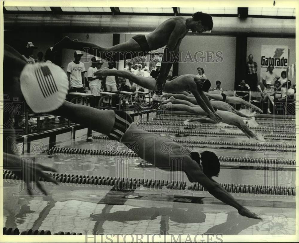 1986 Press Photo Texas Games Swimmers Dive In at Start of 100 Meter Freestyle- Historic Images