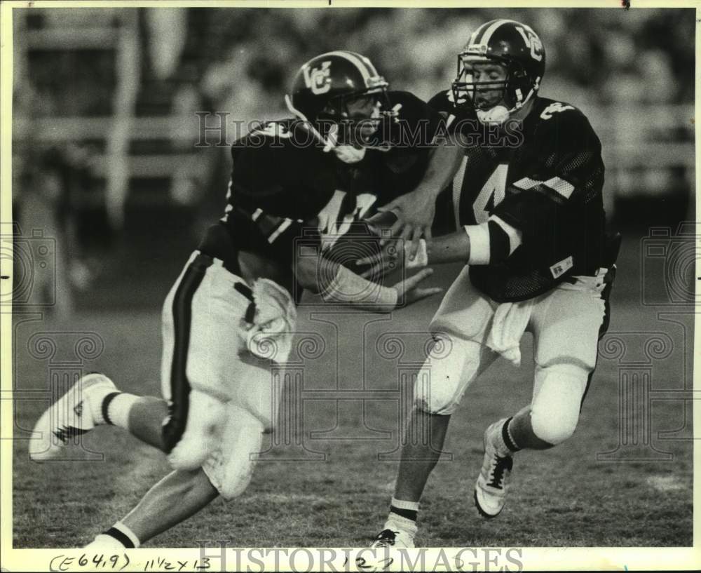 1987 Press Photo Churchill High Football Players Complete a Hand-Off in Game- Historic Images