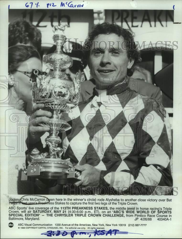 1988 Press Photo Jockey Chris McCarron Holds Trophy After Preakness Stakes Win- Historic Images