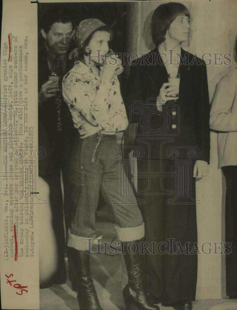 1975 Press Photo Soviet Gymnasts & Coach's Wife Sip Drinks in Atlanta, Georgia- Historic Images