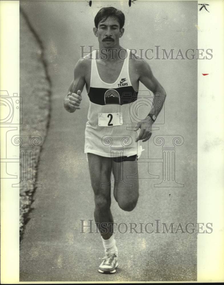 1974 Press Photo Runner Robert Yara Runs on Track in Uniform - sas21083- Historic Images