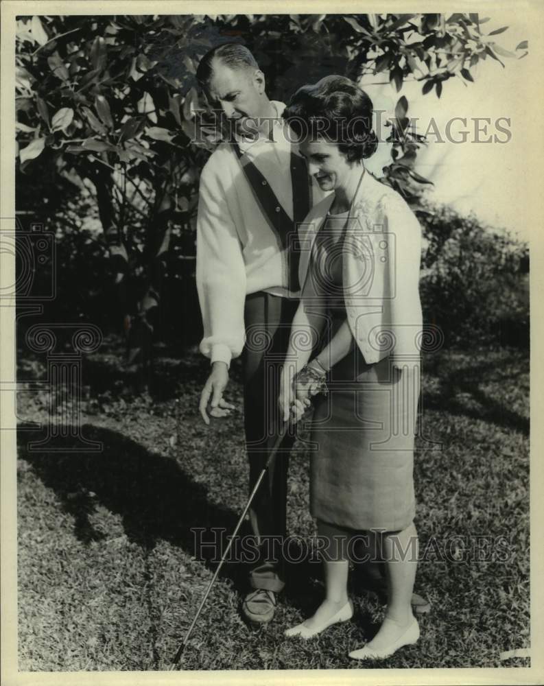 1965 Press Photo Walter Corrigan Instructs Woman on Golf Swing - sas21206- Historic Images