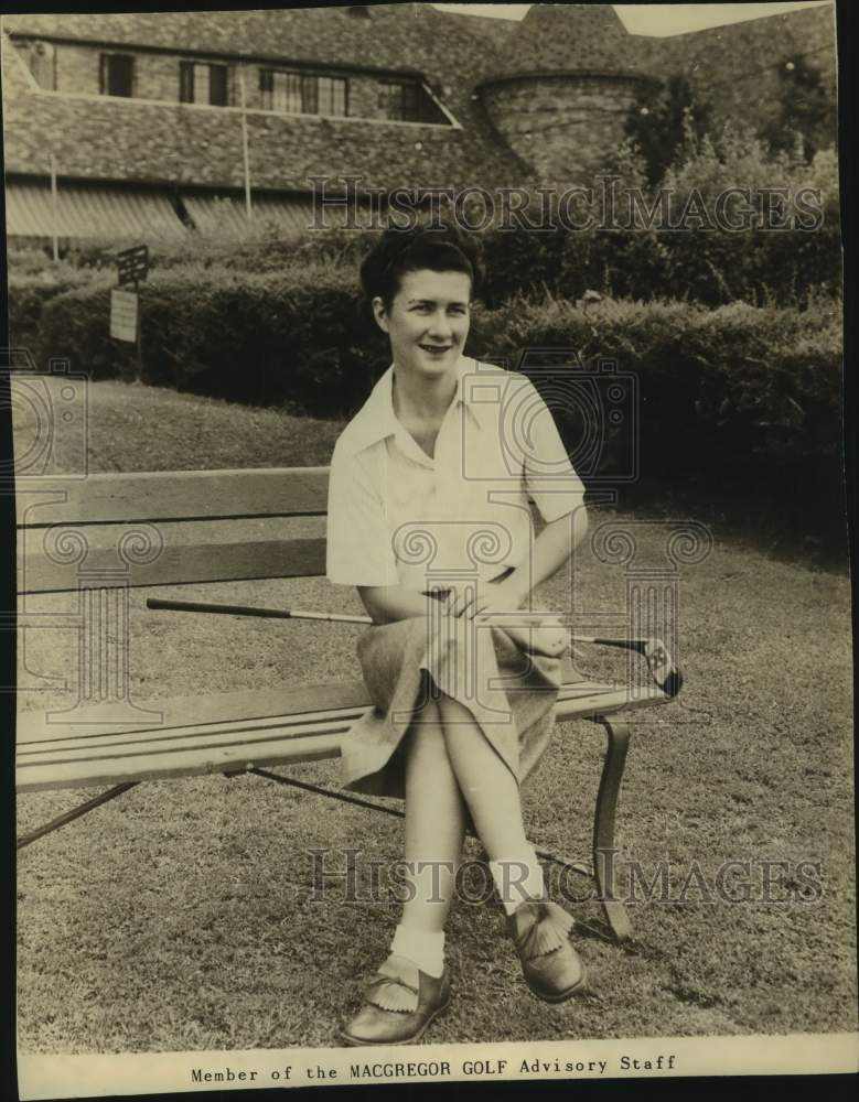 Press Photo Golfer Louise Suggs Sits on Bench With Club - sas21344- Historic Images