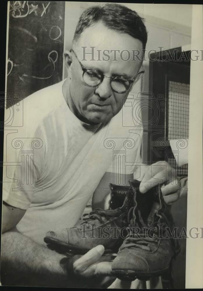 Press Photo Football Coach Leo Dutch Meyer Holds Cleats - sas21460- Historic Images