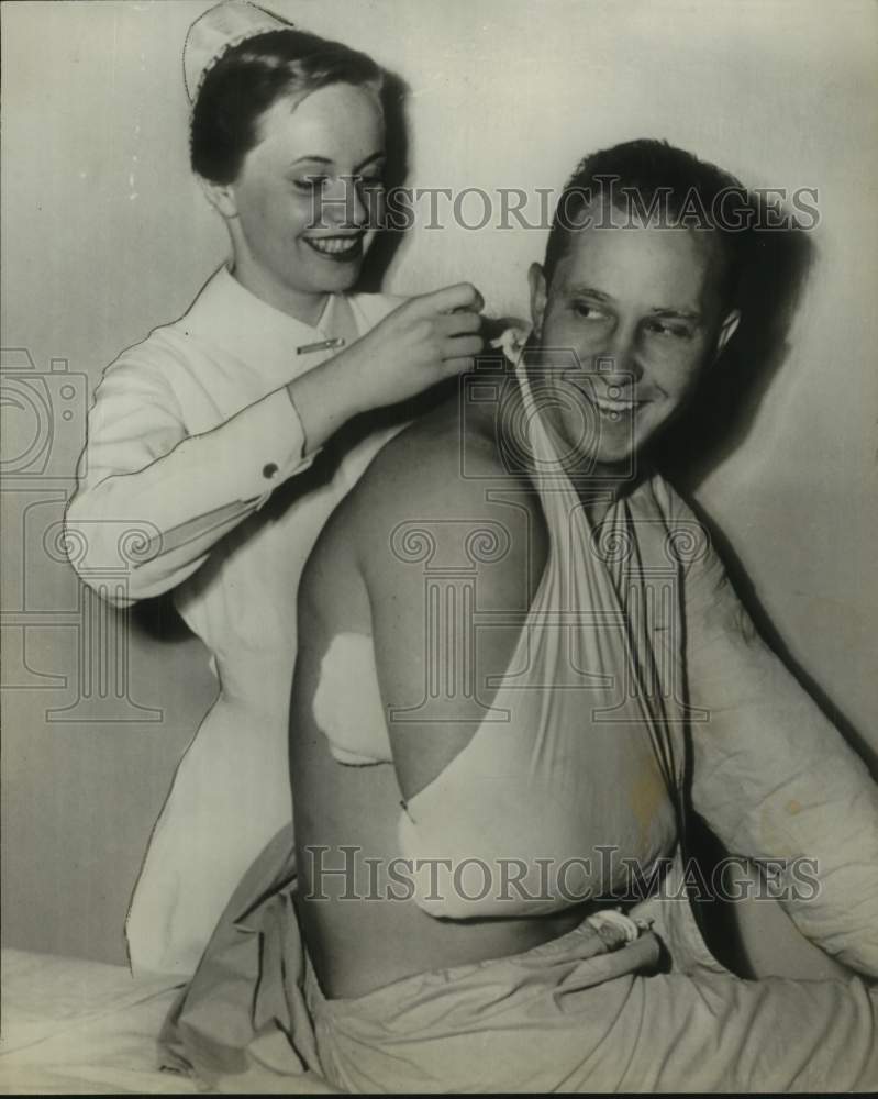 1952 Press Photo Hopkins Nurse Puts Baseball Player Roy Seivers&#39; Arm in Sling- Historic Images