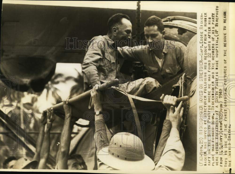 1942 Press Photo Captain Eddie Rickenbacker moved by stretcher after his rescue- Historic Images