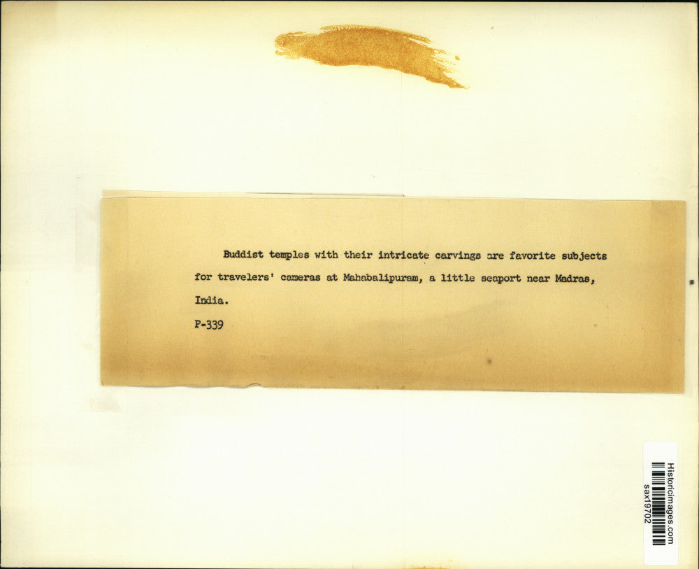 Press Photo Tourist takes picture of Buddhist temples in Madras, India.