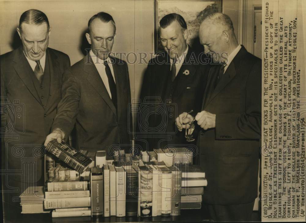 1954 Press Photo President Eisenhower receiving a gift of books, Washington- Historic Images