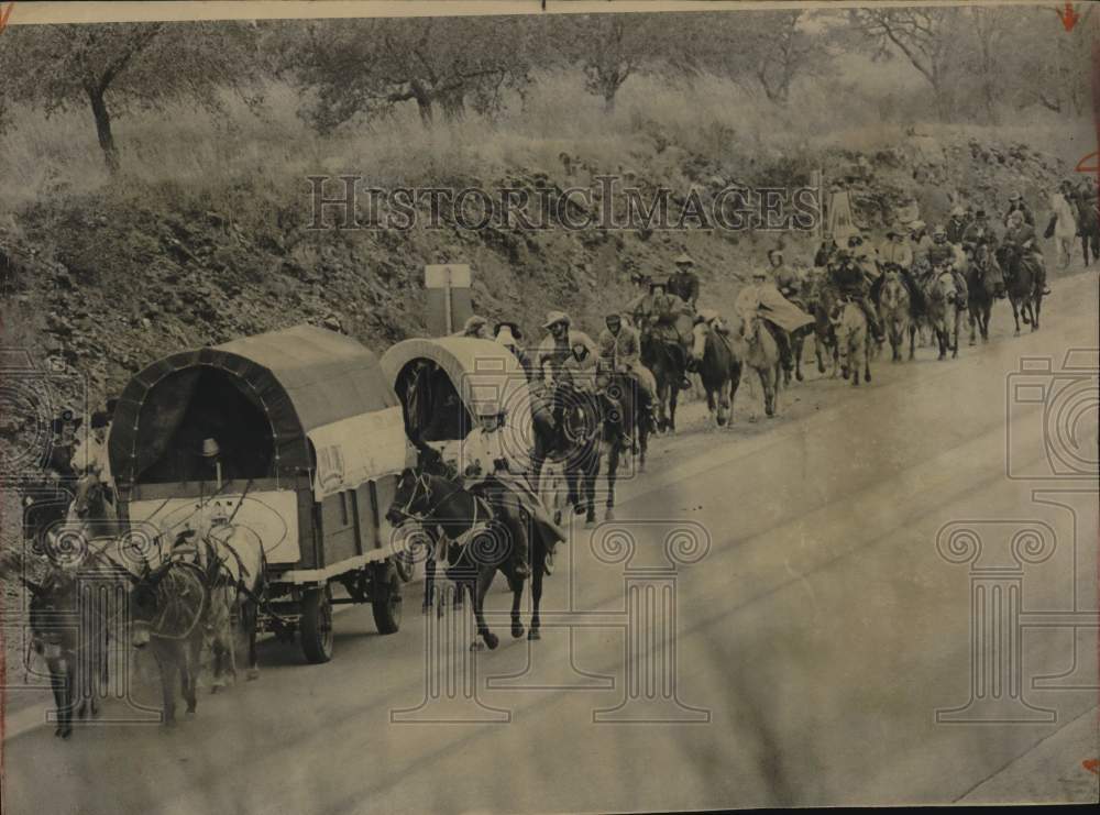 Press Photo Trail riders march down the street- Historic Images