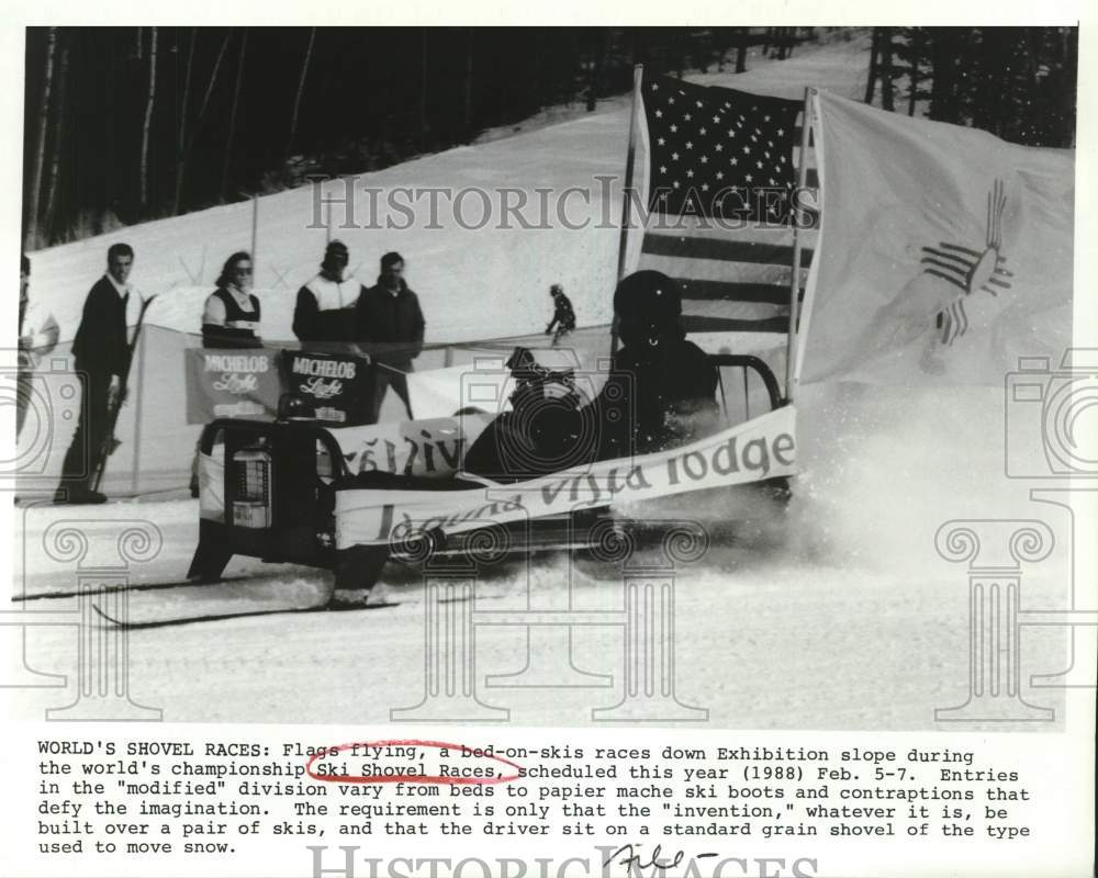 Press Photo A bed-on-skis races down Exhibition slope during Ski Shovel Races- Historic Images