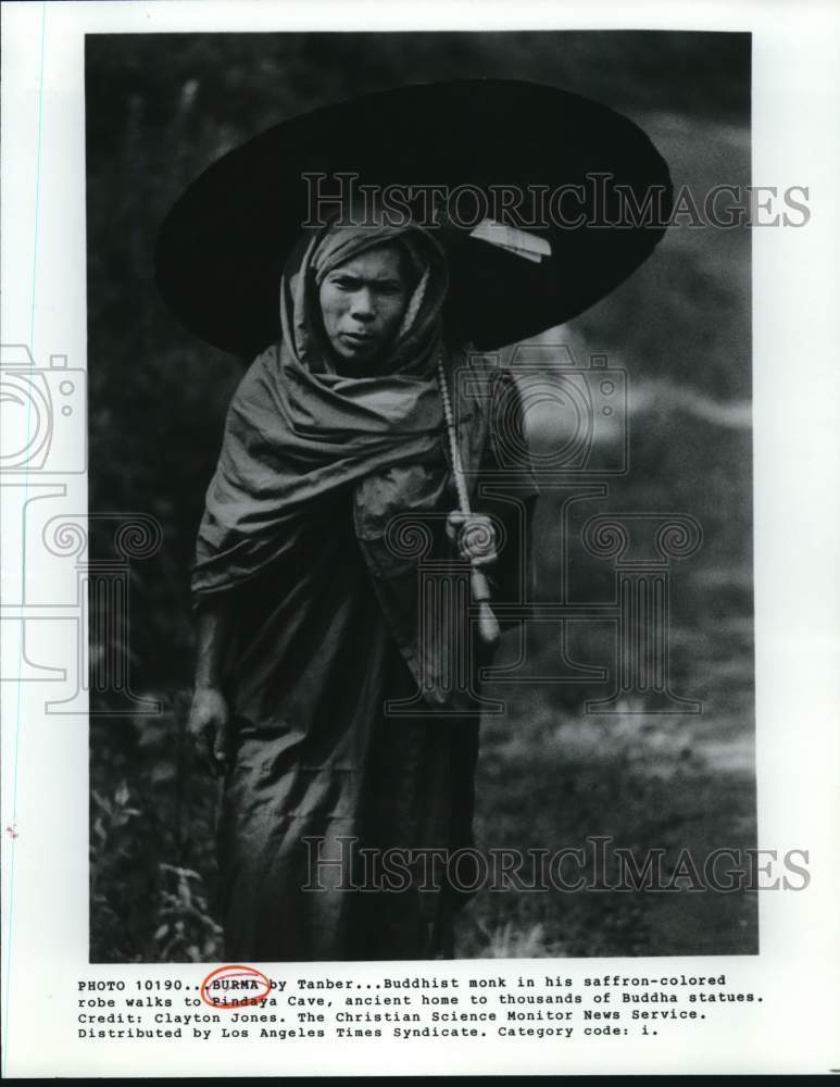 Press Photo Buddhist monk in saffron-colored robe walks to Pindaya Cave, Burma- Historic Images