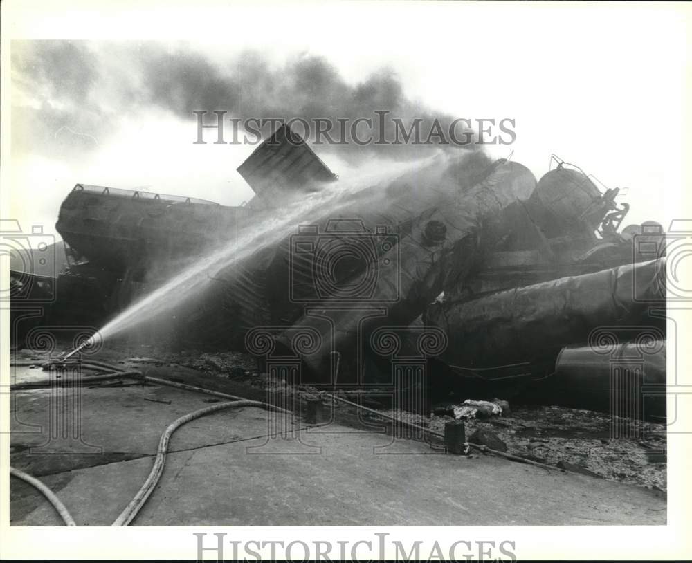 Press Photo Water poured into smoking train after derailment - sax25284- Historic Images