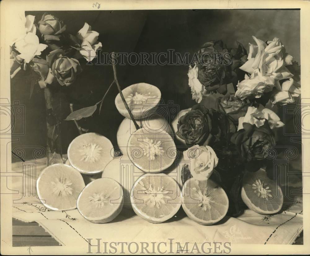 Press Photo A still life with grapefruit and flowers - sax25692- Historic Images