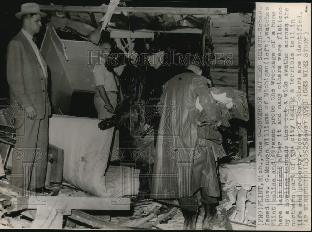 1953 Press Photo Gov. Williams of Michigan watches probe of tornado-torn home- Historic Images