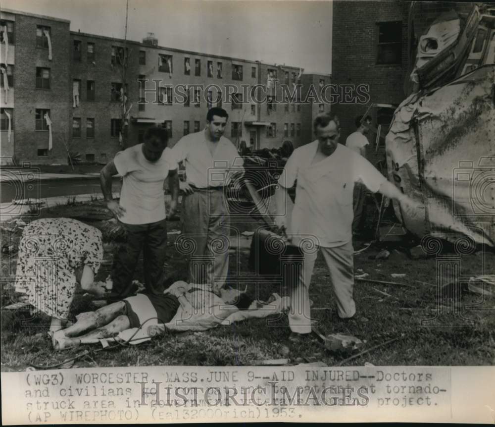 1953 Press Photo Doctors, civilians aid injured in tornado-struck Worcester, MA- Historic Images