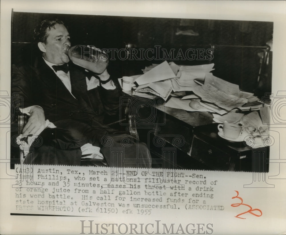 1955 Press Photo Sen Jimmy Phillips of Texas takes a drink of orange juice