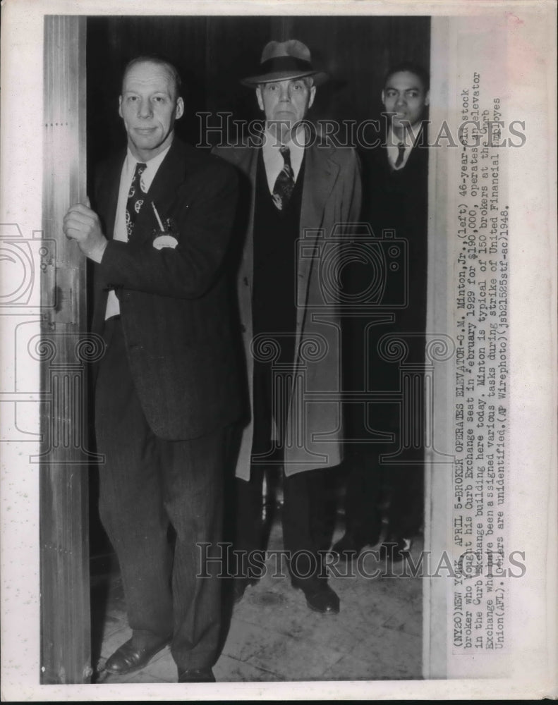 1948 Press Photo G.M. Minton, stock broker at the Curb Exchange - sba07637- Historic Images