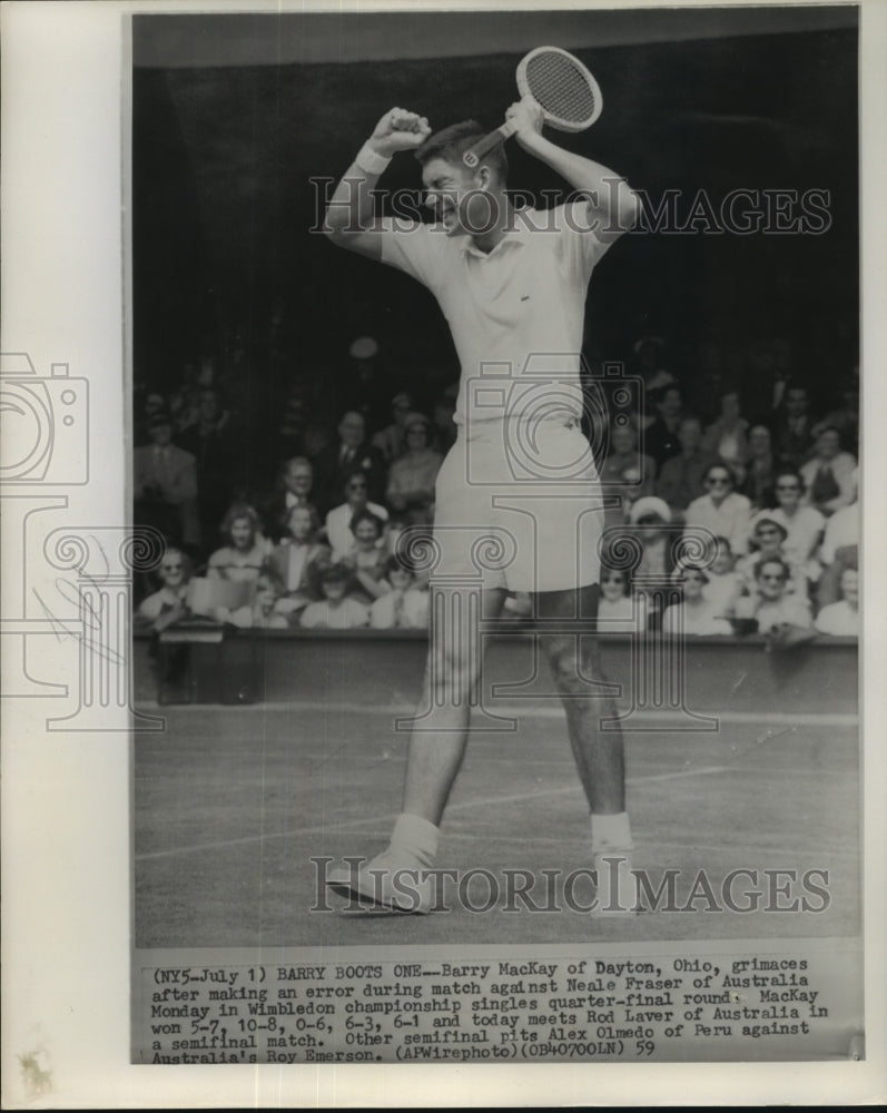 1959 Press Photo Barry MacKay shown with a grimace expression at a tennis match- Historic Images