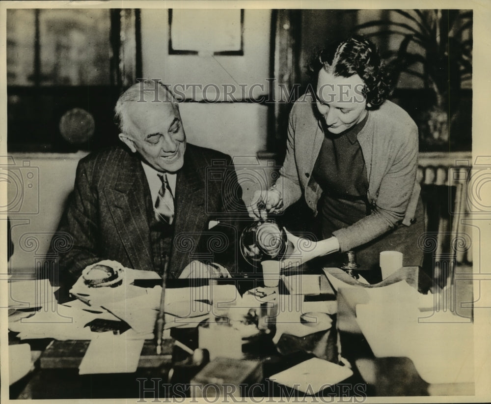 1937 Press Photo Clarence Dykstra, Flood Relief head having a break at his desk