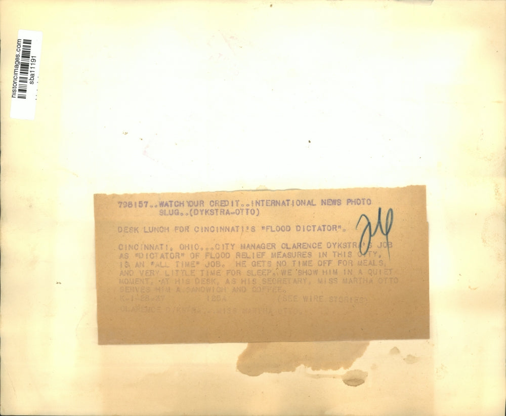 1937 Press Photo Clarence Dykstra, Flood Relief head having a break at his desk