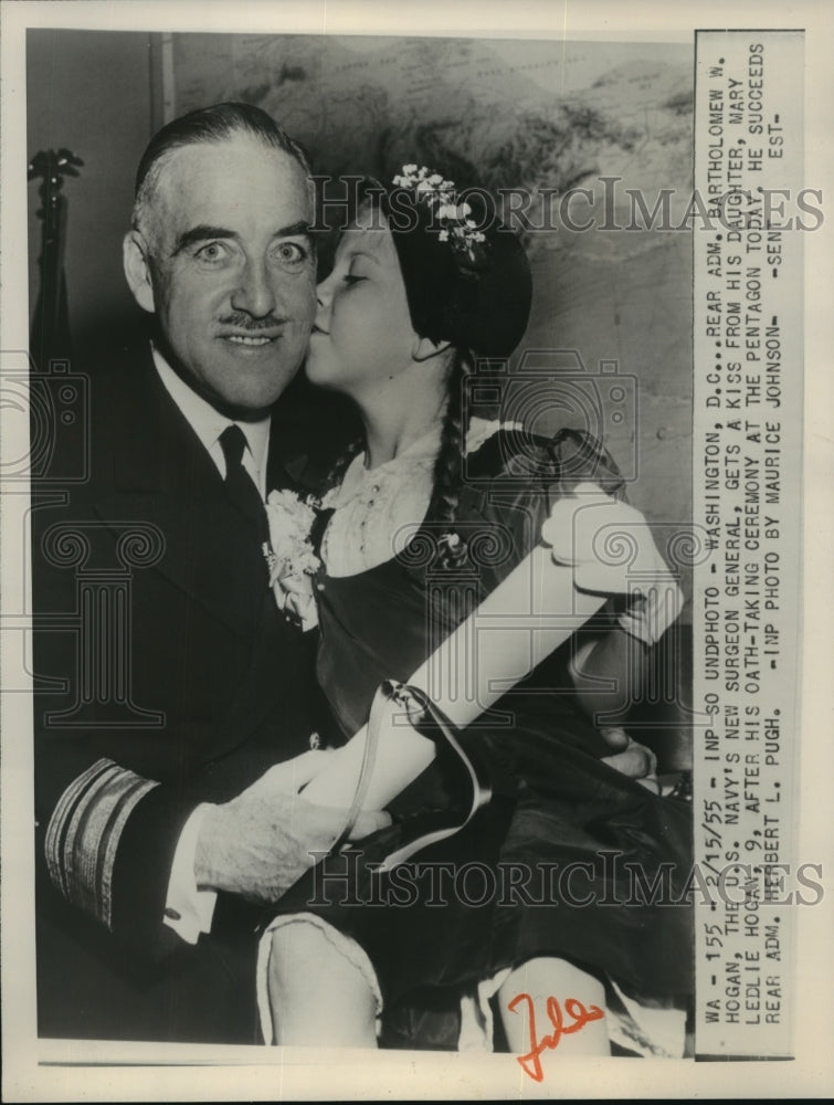 1955 Press Photo Rear Admiral Bartholomew W. Hogan gets a kiss from daughter