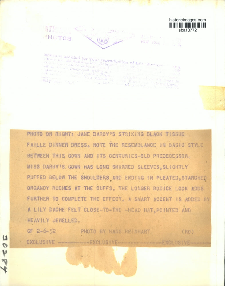 1952 Press Photo Jane Darby wears a long shirred sleeves gown with smart accent