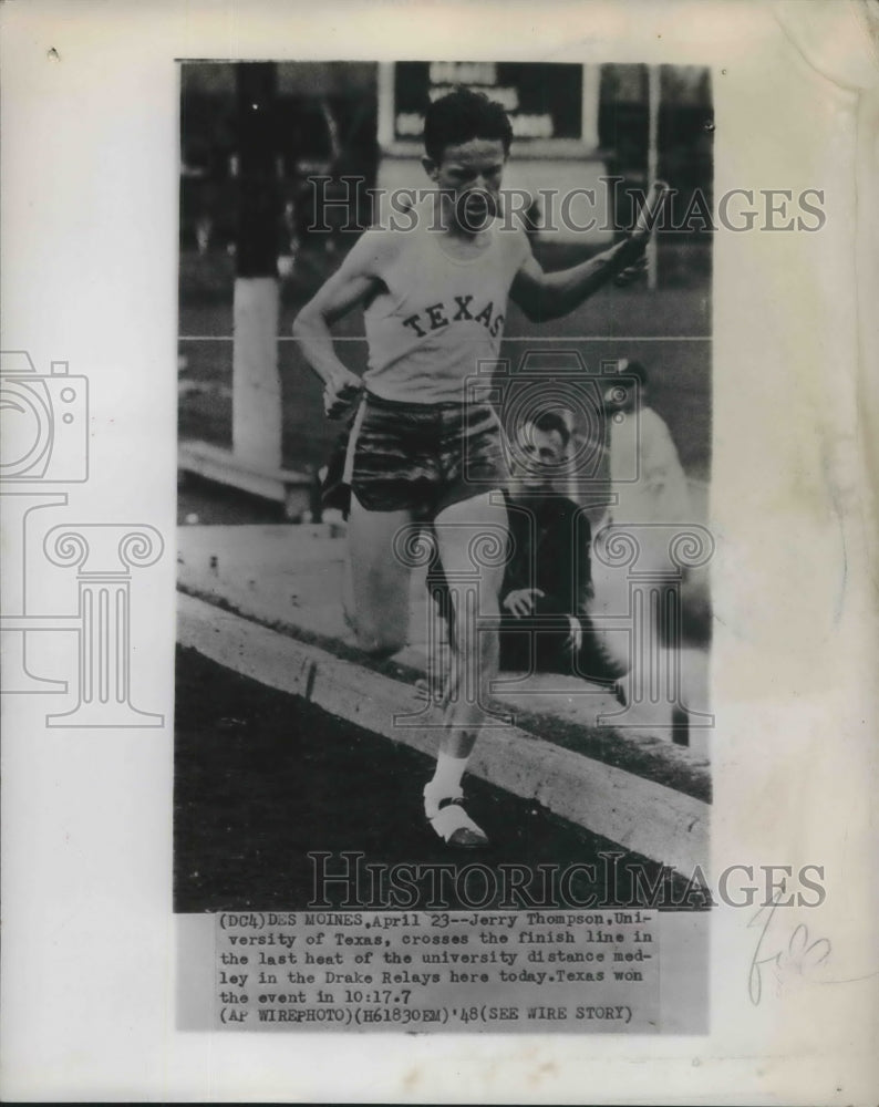 1948 Press Photo Jerry Thompson crosses finish line in distance medley race