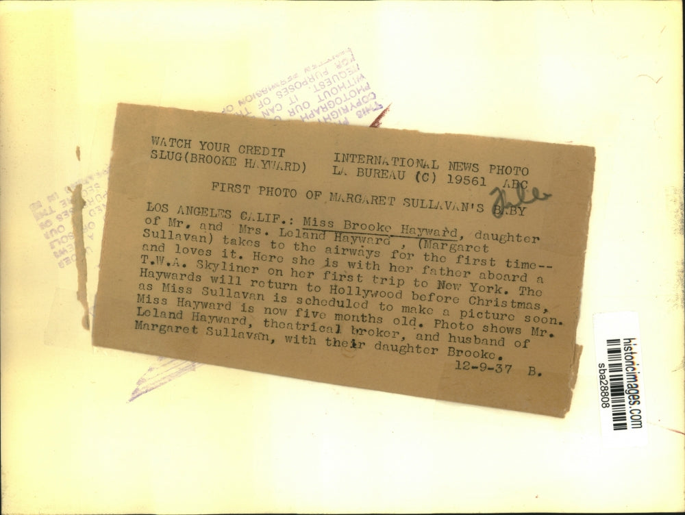 1937 Press Photo Leland Hayward holds daughter Brooke aboard airplane