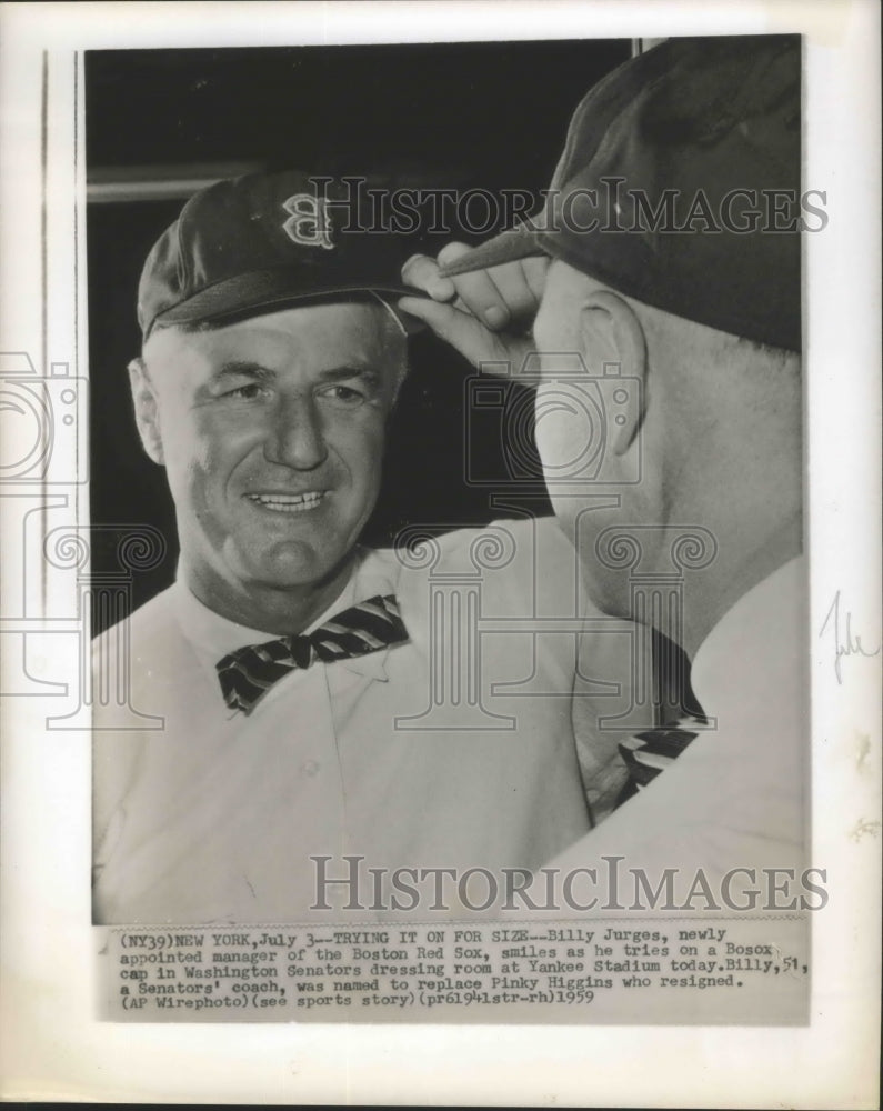 1959 Press Photo Billy Jurges smiles as he tries on a Bosox cap - sbs01548- Historic Images