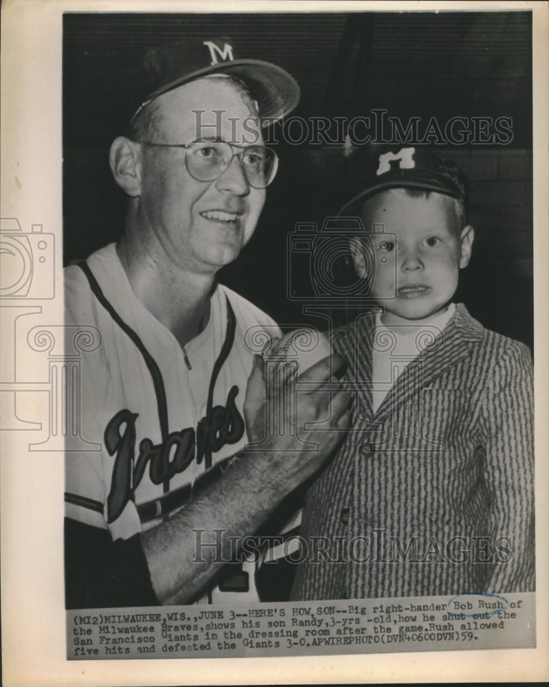 1959 Press Photo Braves&#39; Bob Rush shows his son Randy how he shut out Giants- Historic Images