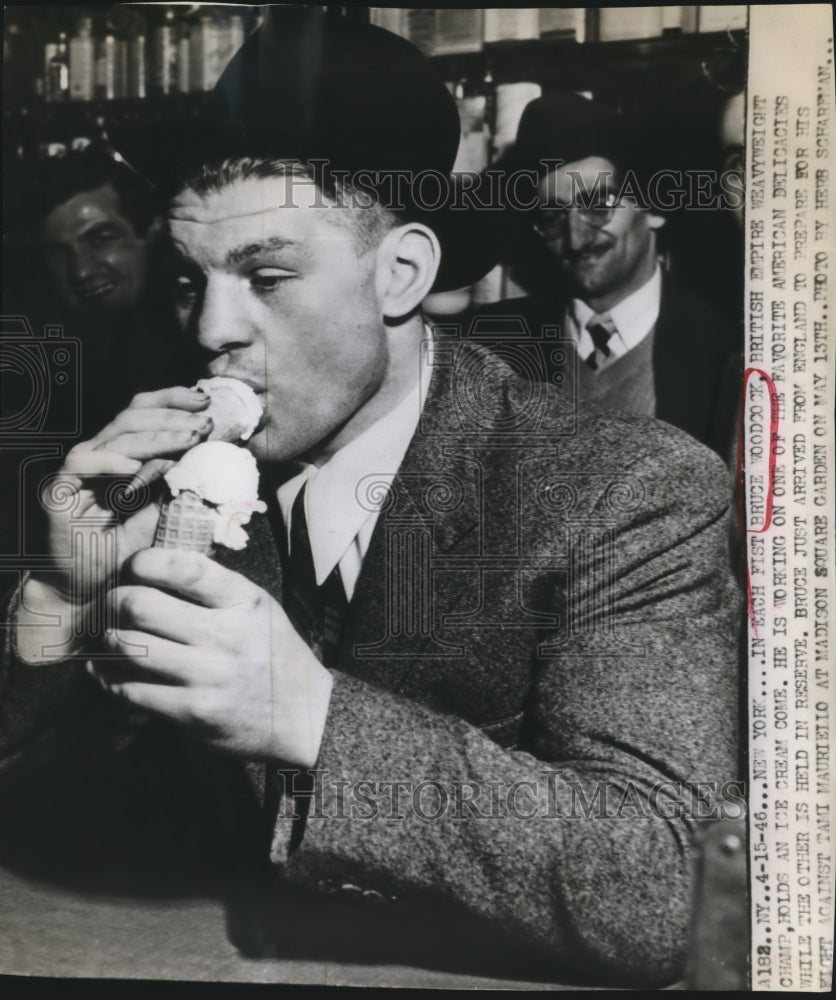 1946 Press Photo Bruce Woodcock holds an ice cream cone in each hand - sbs07440- Historic Images