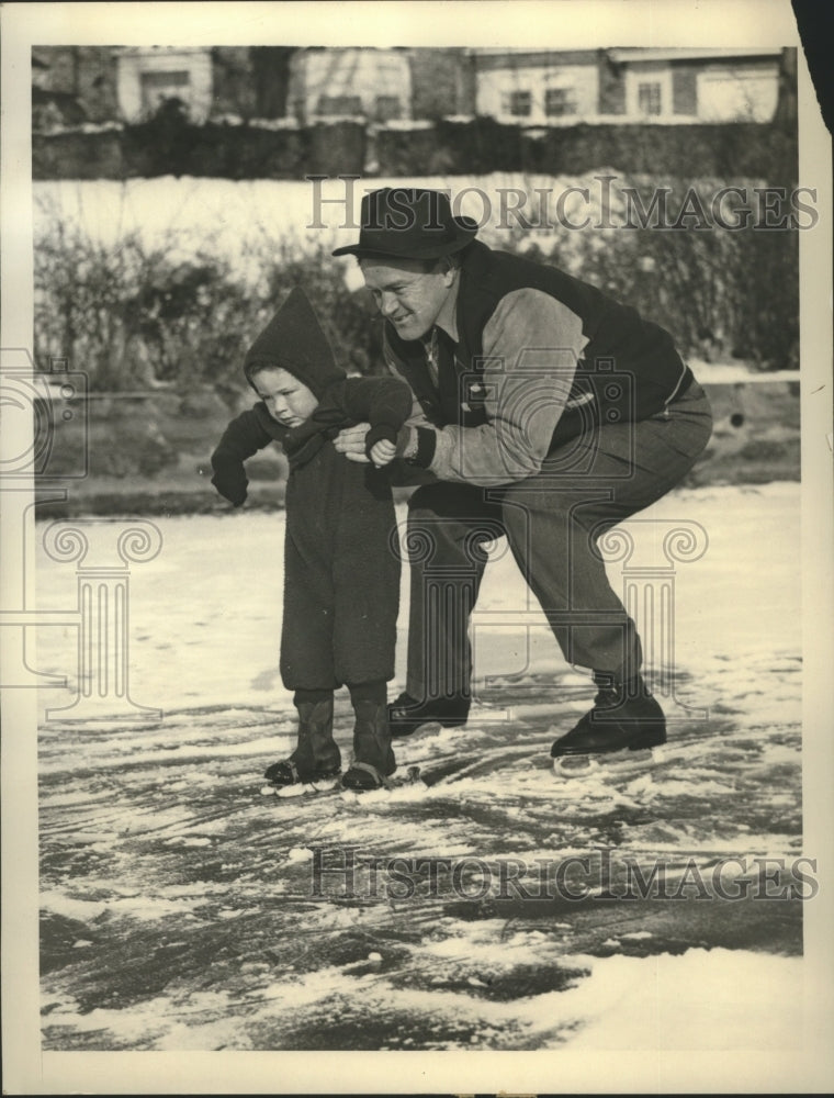 1941 Press Photo Joe Cronin giving his son, Tommy ice skating lessons- Historic Images