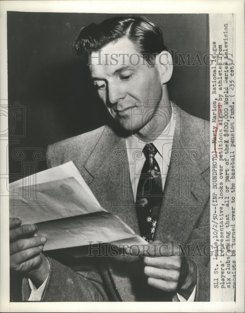 1950 Press Photo Marty Marion National League Players Rep looks over petitions- Historic Images