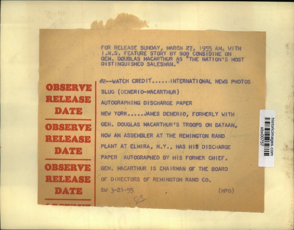 1955 Press Photo James Denerio gets discharges paper signed by Gen. MacArthur