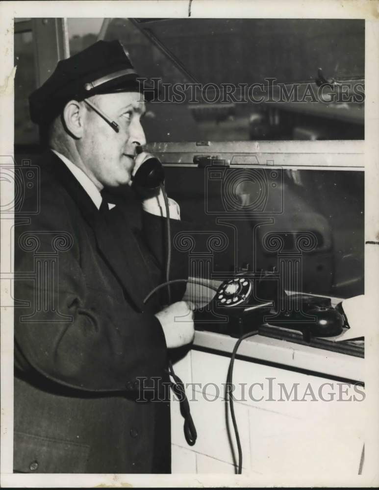 1951 Press Photo A bus official on the telephone - sia03259
