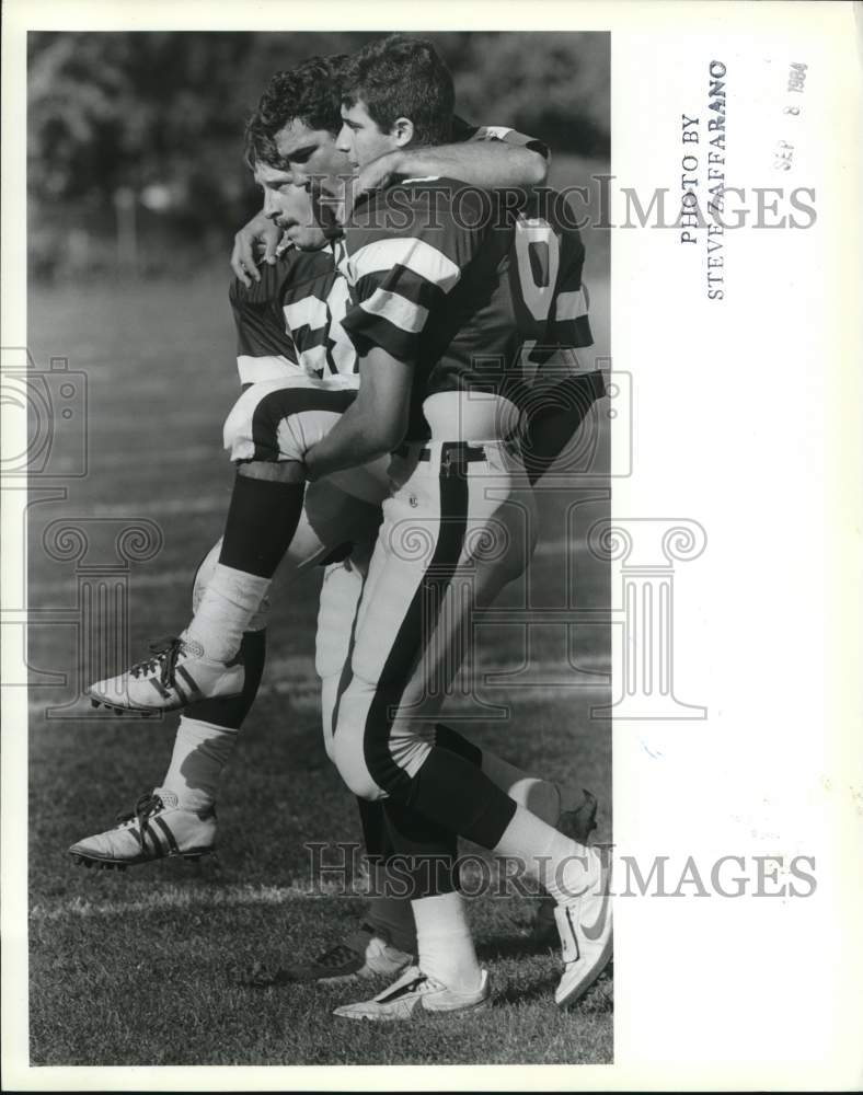 1984 Press Photo Wagner College Football Players Carried Injured Man Off Field- Historic Images