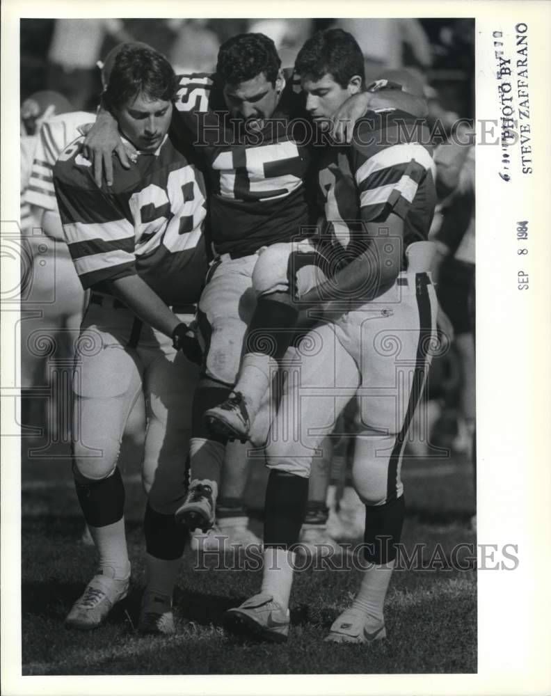 1984 Press Photo Wagner College Football Player Carried Off Field Injured- Historic Images