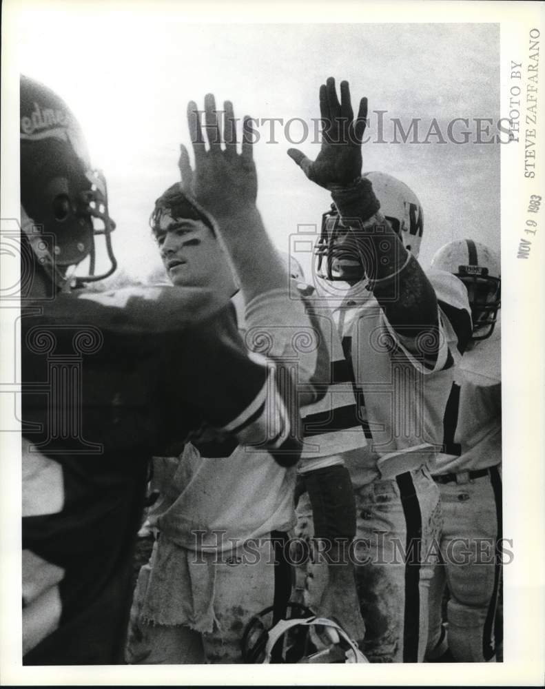 1983 Press Photo Wagner College Football Players High-Five Opponents After Game- Historic Images