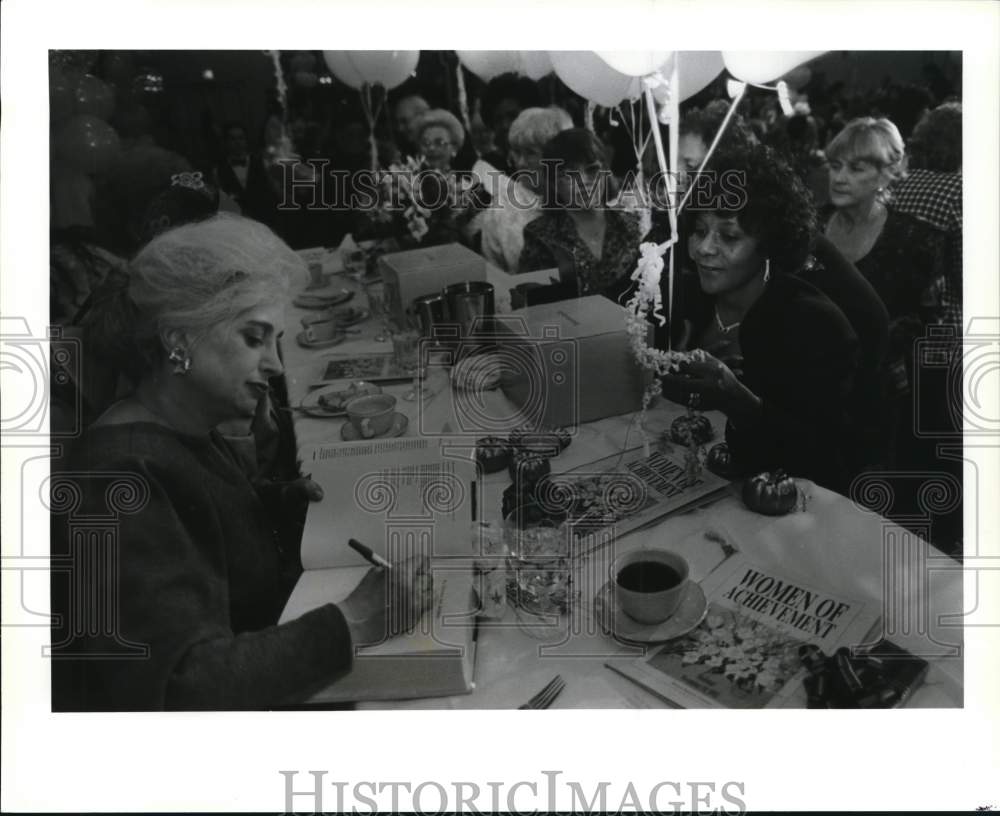 1992 Press Photo Miss Manners signs her books at Women of Achievement luncheon