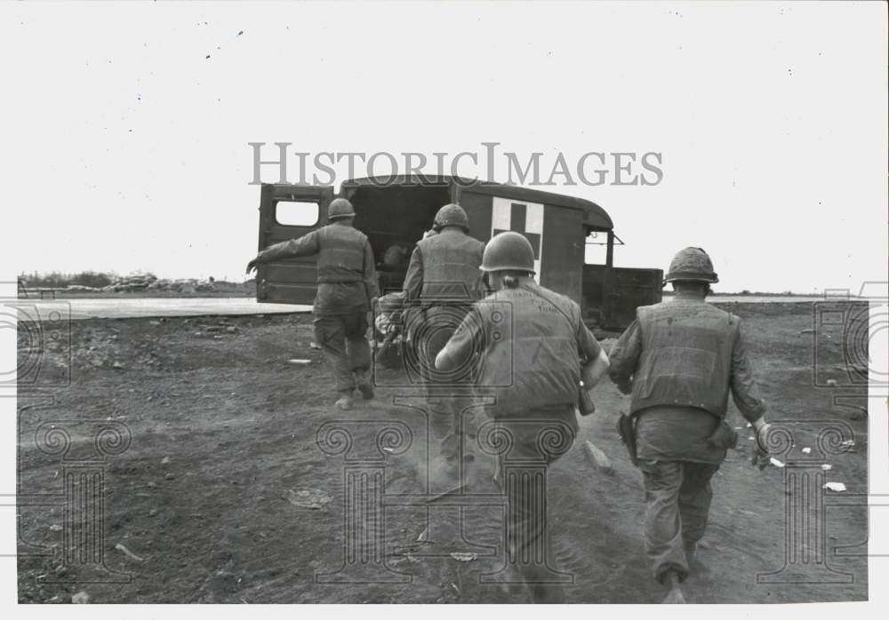 1968 Press Photo Military Medics Escort Injured Soldier to Ambulance - sia37672