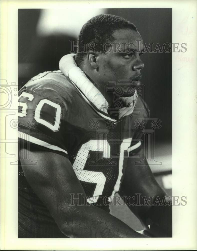 1990 Press Photo Football player Eric Moore on the bench - sis00798- Historic Images