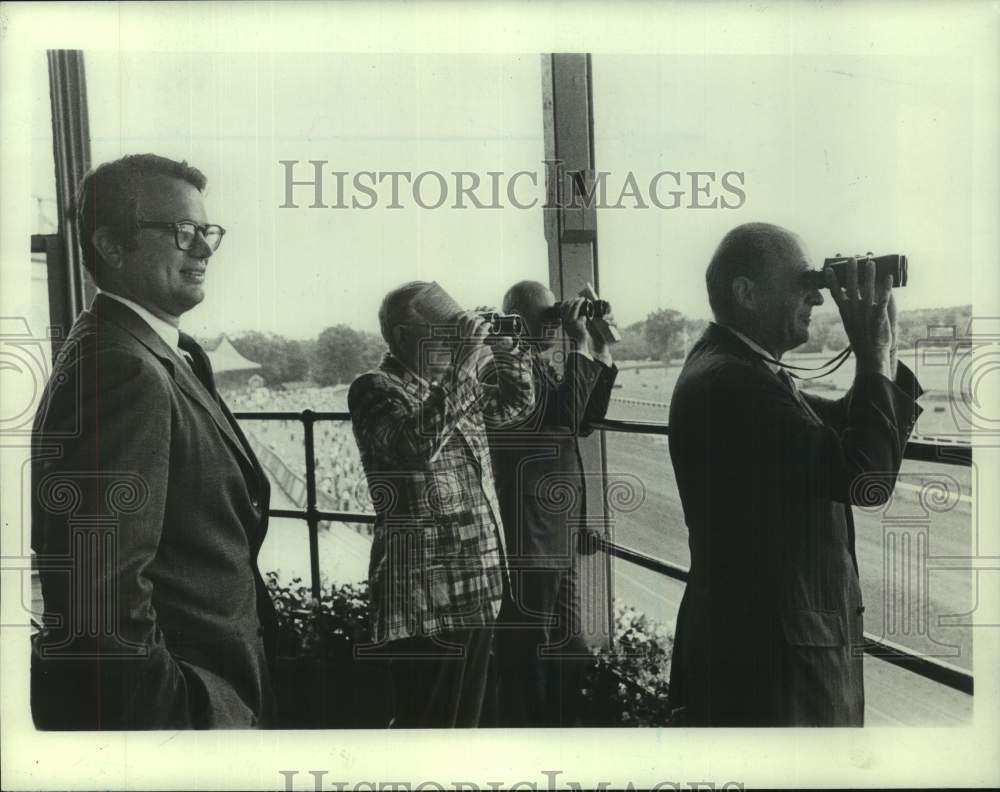 Press Photo John Krumpe and companions survey a race track - sis01081- Historic Images