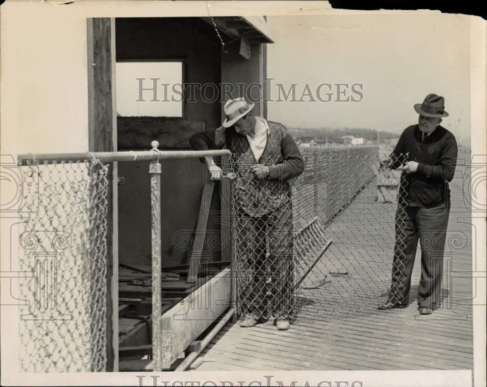 1938 Press Photo Workers Constructing Chain Link Fence on Boardwalk - sis02819- Historic Images