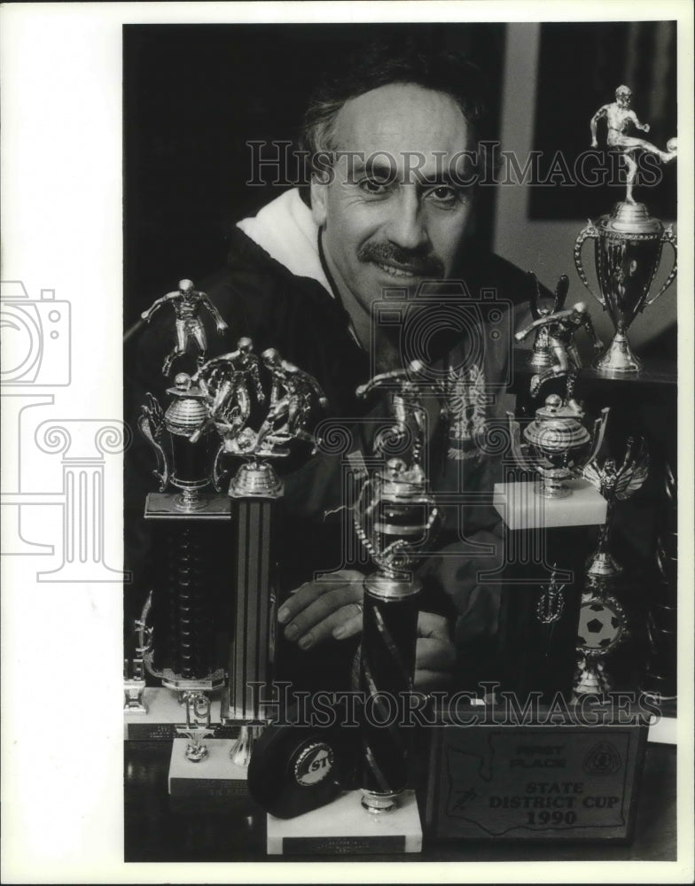 1991 Press Photo Spokane soccer coach Mannie Faridnia and his trophies- Historic Images