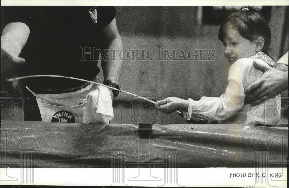 1988 Press Photo Erica Dean catches trout at Big Horn Sports and Recreation Show- Historic Images