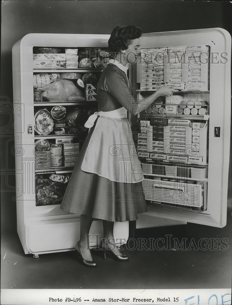 1956 Press Photo A beautiful model poses with Amana Stor-Mor Freezer, Model 15- Historic Images