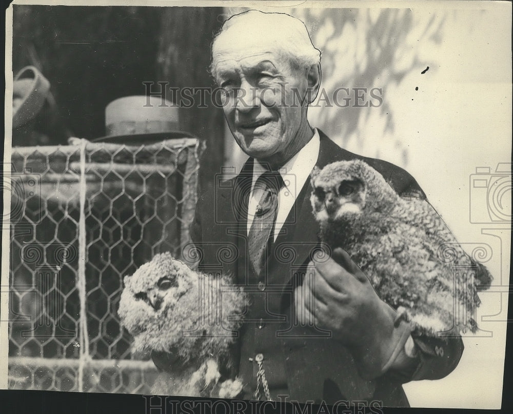 1929 Press Photo Man holds two owls - sps07704- Historic Images