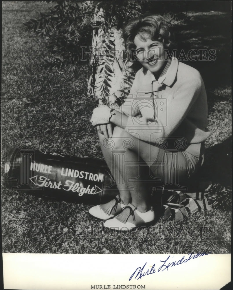 1964 Press Photo Golfer Murle Lindstrom Sits on Her Golf Bag - sps10591- Historic Images