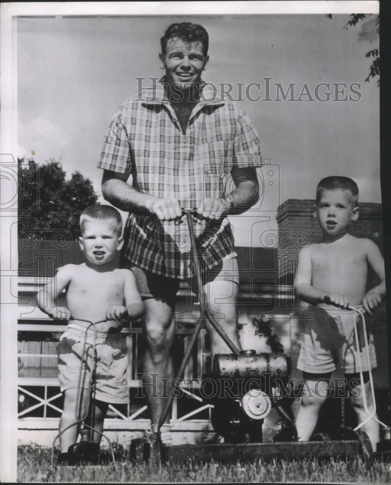 1958 Press Photo Football player Will Wade with his two boys cutting the grass- Historic Images